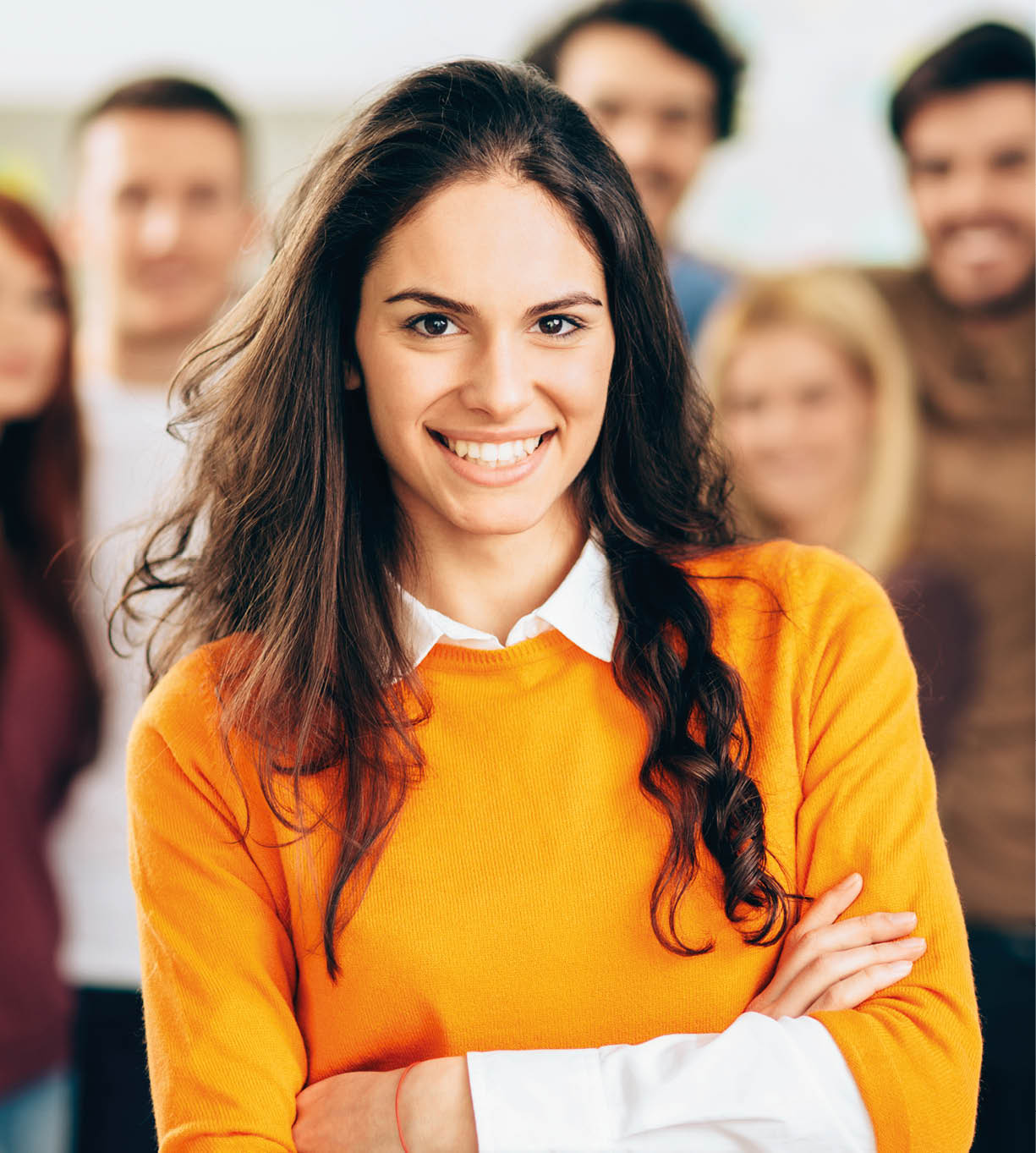 Portrait of young smiling woman in the office.