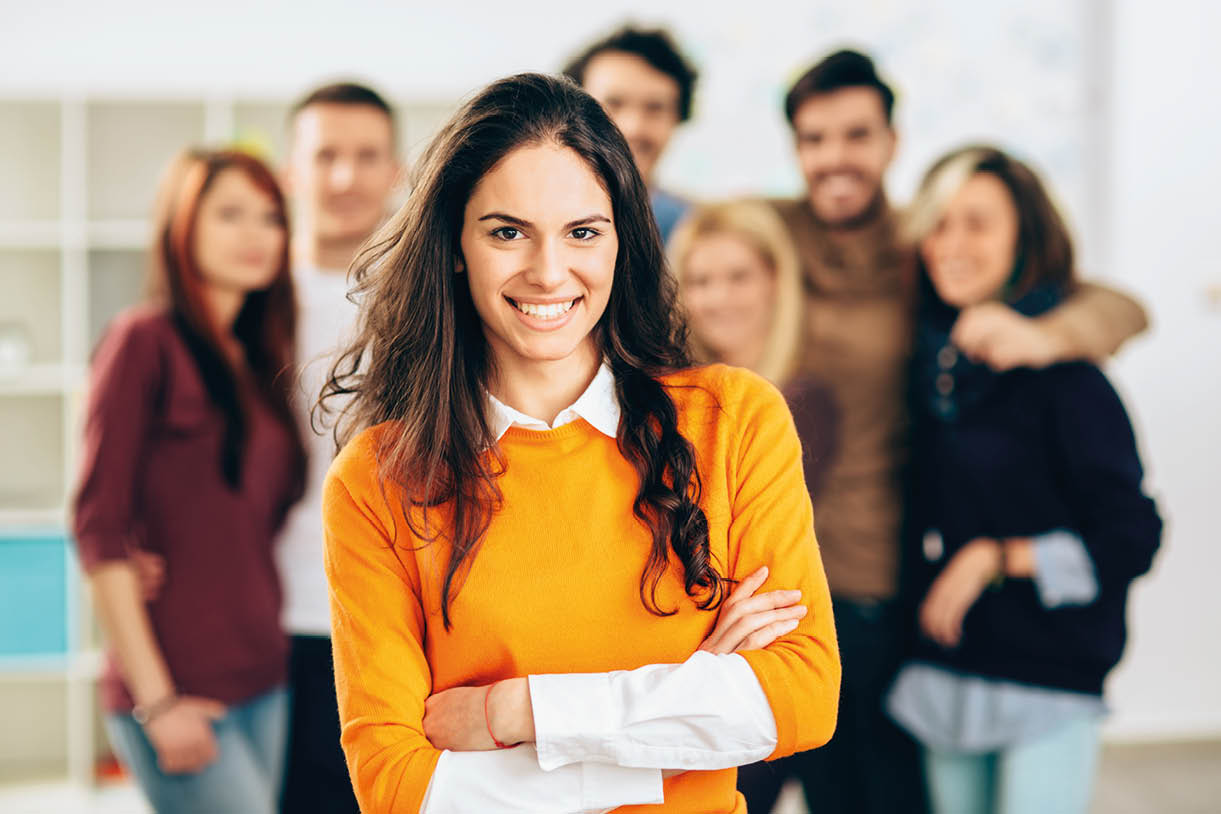 Portrait of young smiling woman in the office.